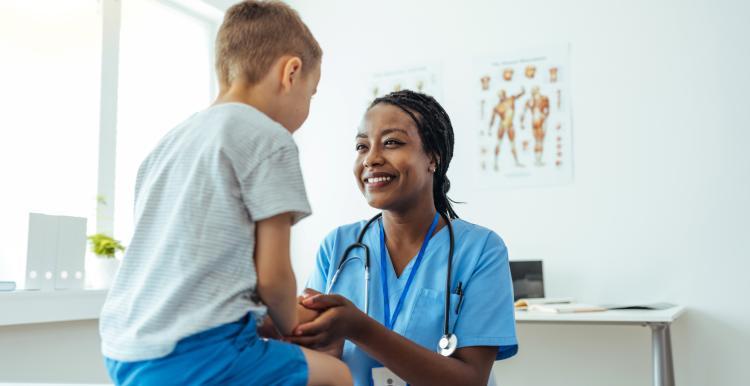 Nurse talking to a young child