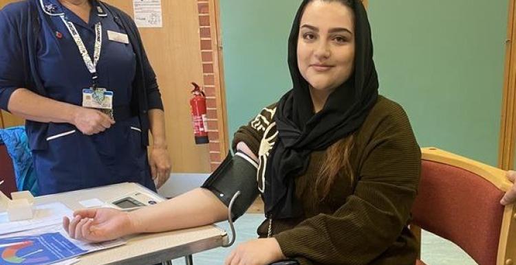 An Afghan woman having her blood pressure checked.