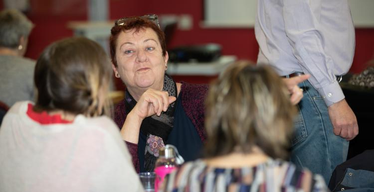 Woman talking at a meeting 
