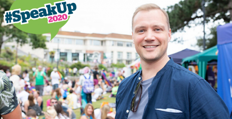 Photo of man smiling at camera with speak up 2020 logo 