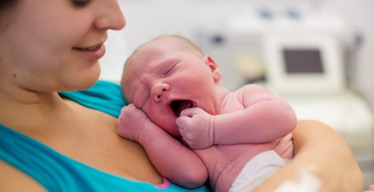 woman holding newborn