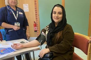 An Afghan woman having her blood pressure checked.