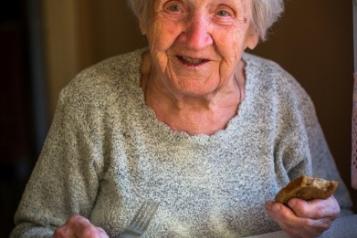 Elderly lady eating 