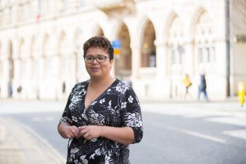 Woman outside smiling at the camera