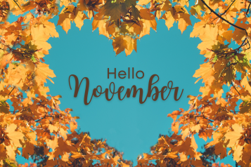 Hello November, leaves on blue background. 